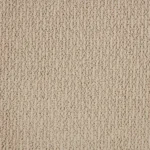 Close-up of beige loop pile carpet texture