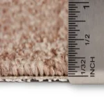 Macro view of carpet pile height with a ruler