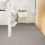 Neutral grey carpet in a modern bedroom setting