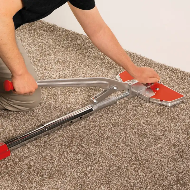 Professional stretching carpet with a power stretcher tool